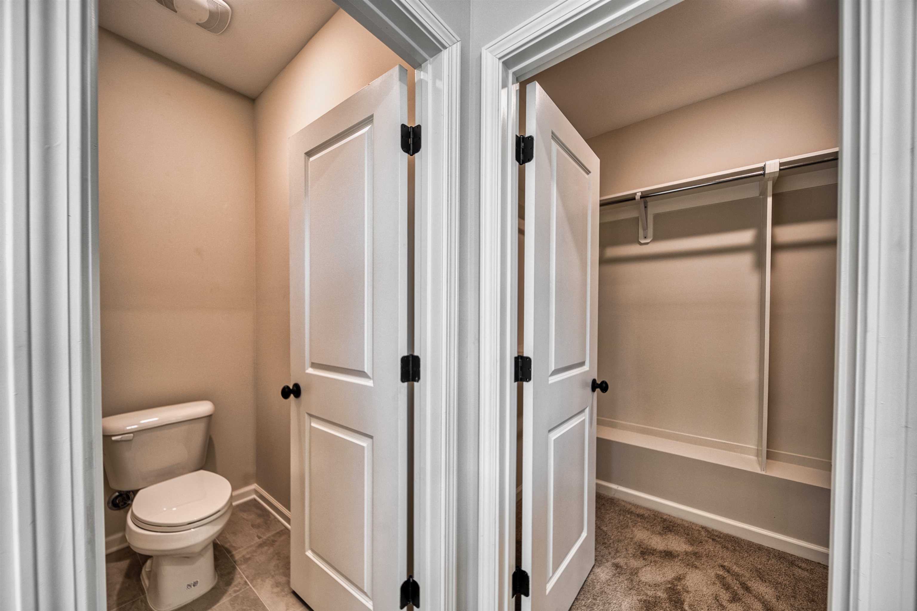 32 Forsyth Lane Munford, TN 38058 - Photo 16 of 35 a bathroom with a toilet and a shower