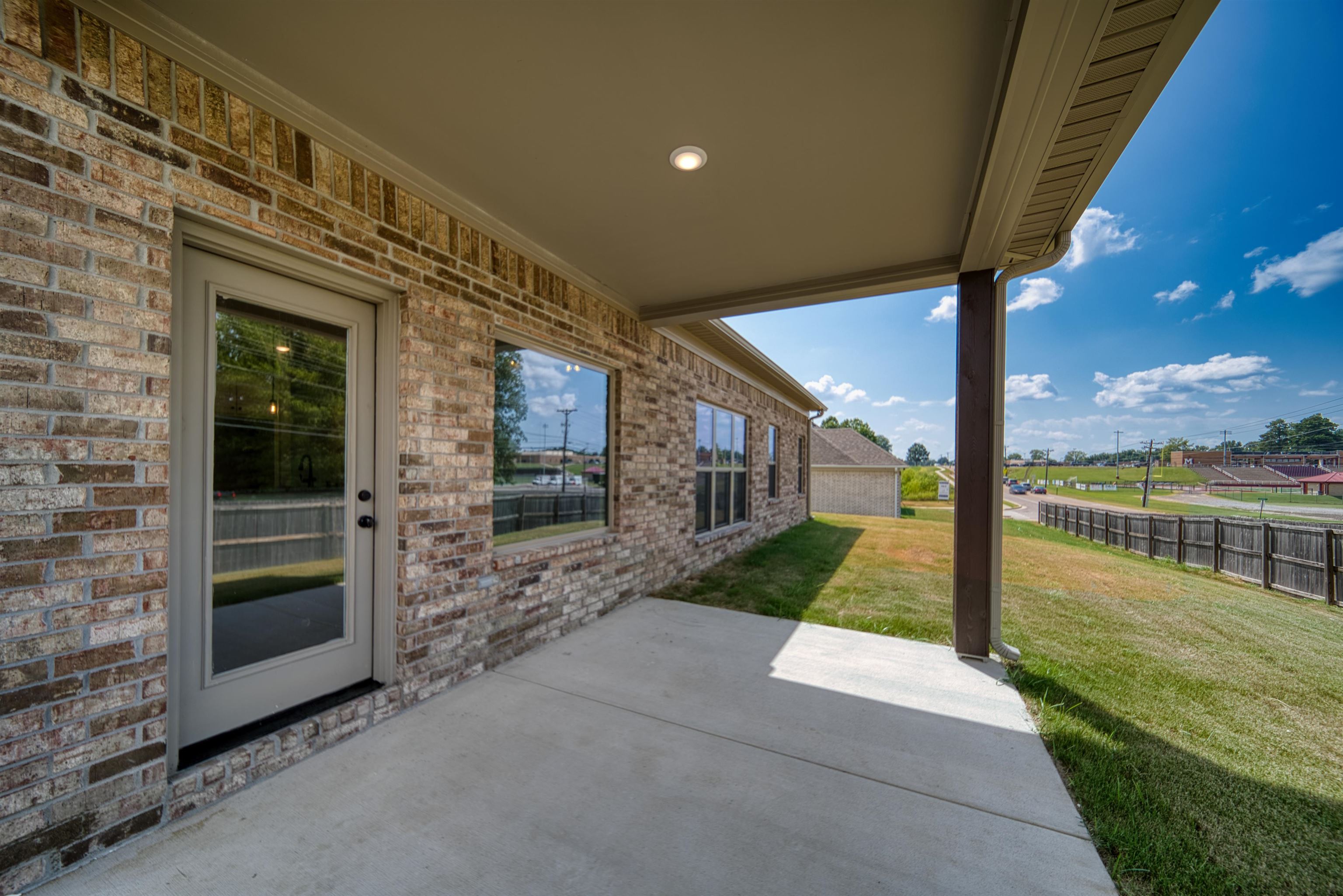 32 Forsyth Lane Munford, TN 38058 - Photo 35 of 35 a view of a porch with a floor to ceiling window next to a yard