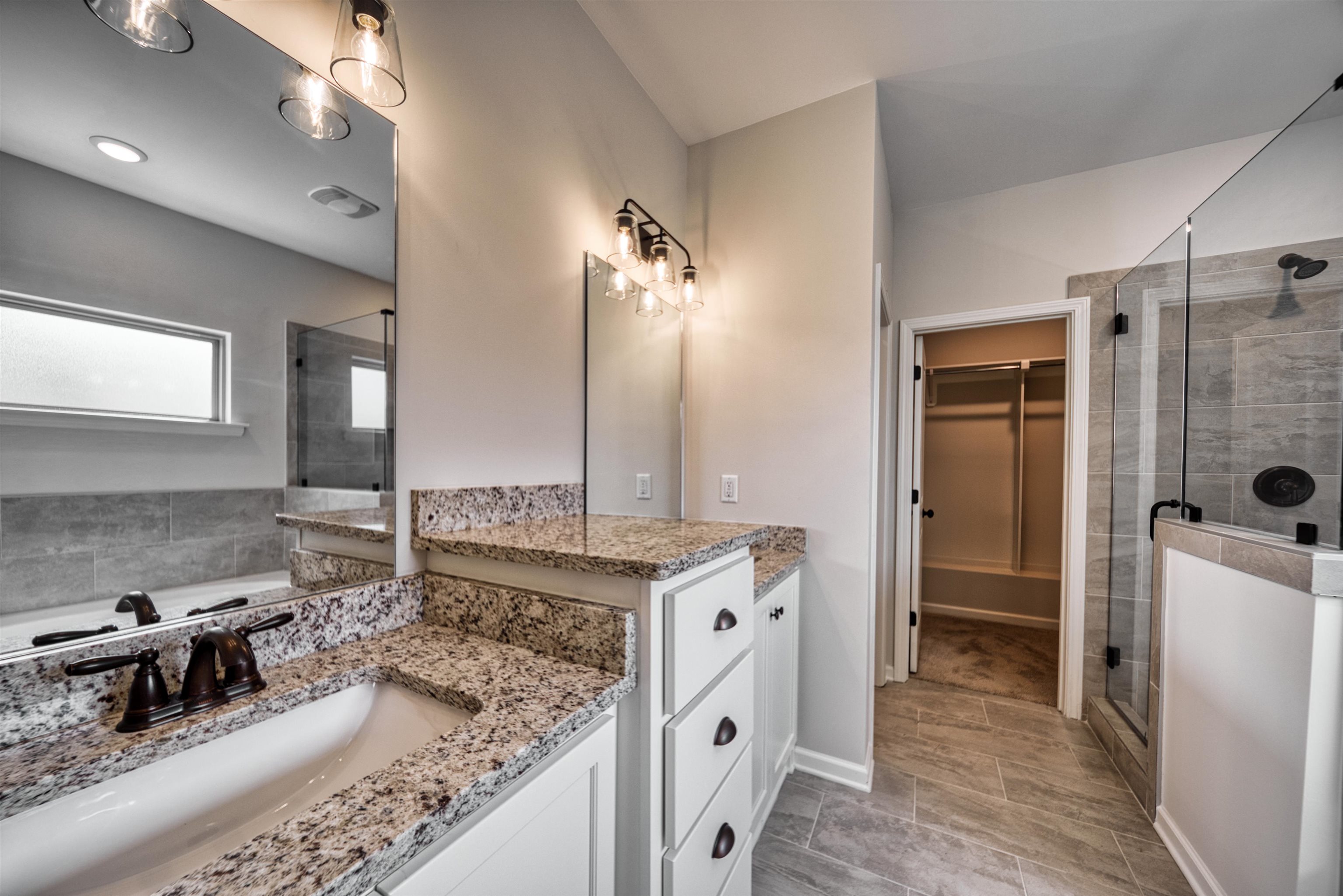 32 Forsyth Lane Munford, TN 38058 - Photo 9 of 35 a kitchen with stainless steel appliances granite countertop a sink stove and refrigerator
