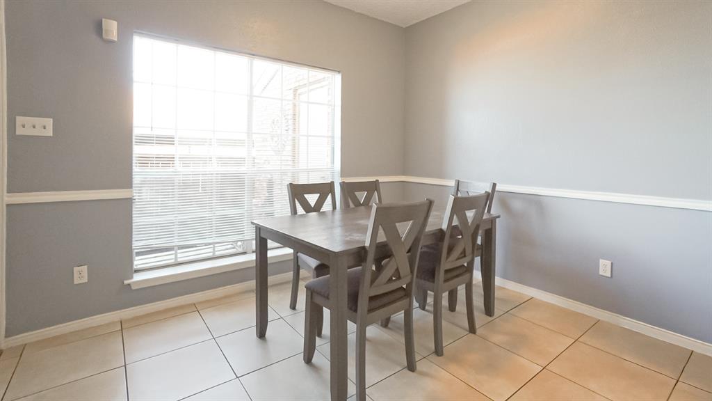 12921 Abrams Road, Unit 505 Dallas, TX 75243 - Photo 4 of 24 Dining area featuring baseboards and light tile patterned floors