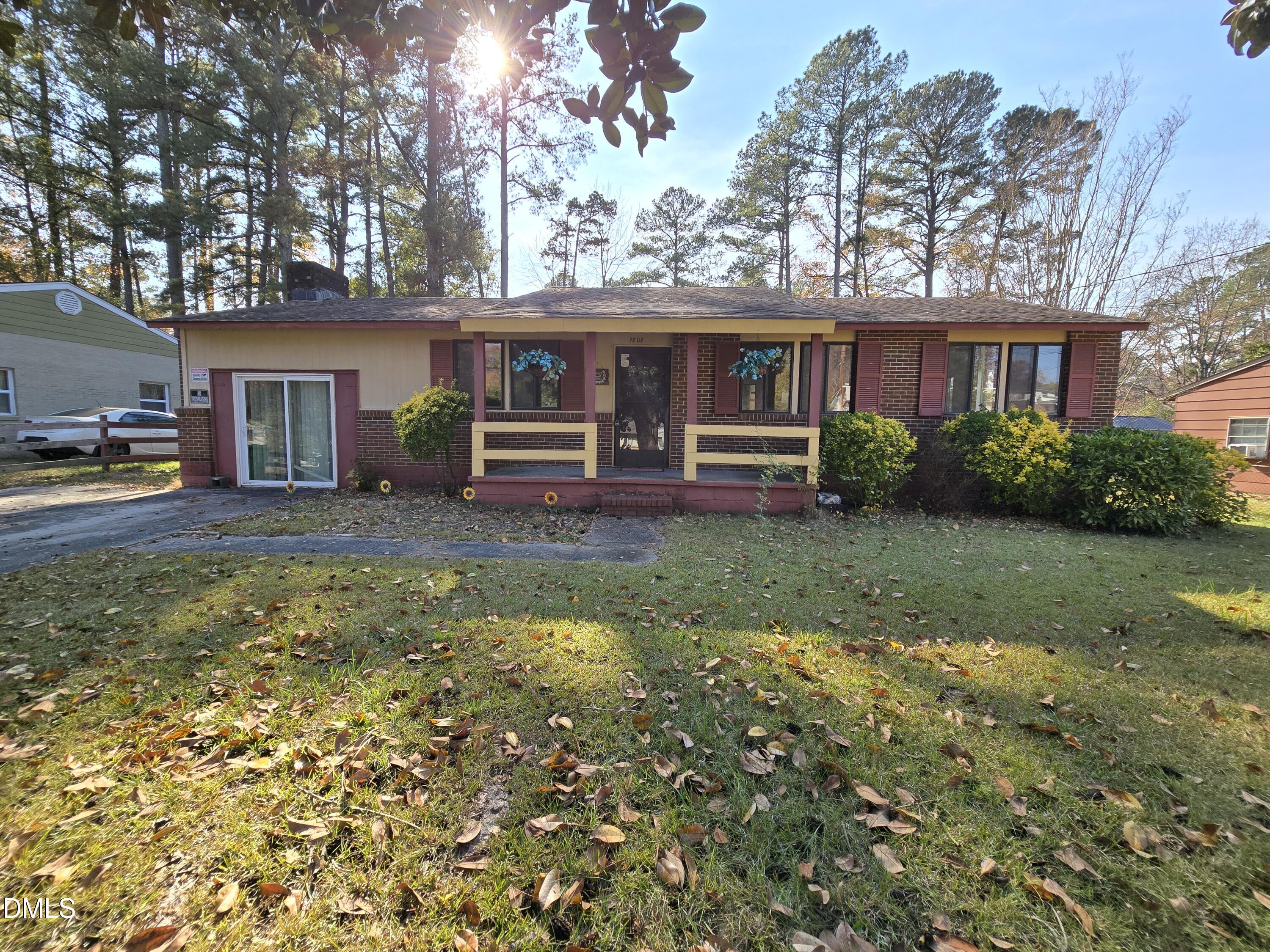 1808 Tee Dee Street Raleigh, NC 27610 - Photo 2 of 10 a front view of a house with garden