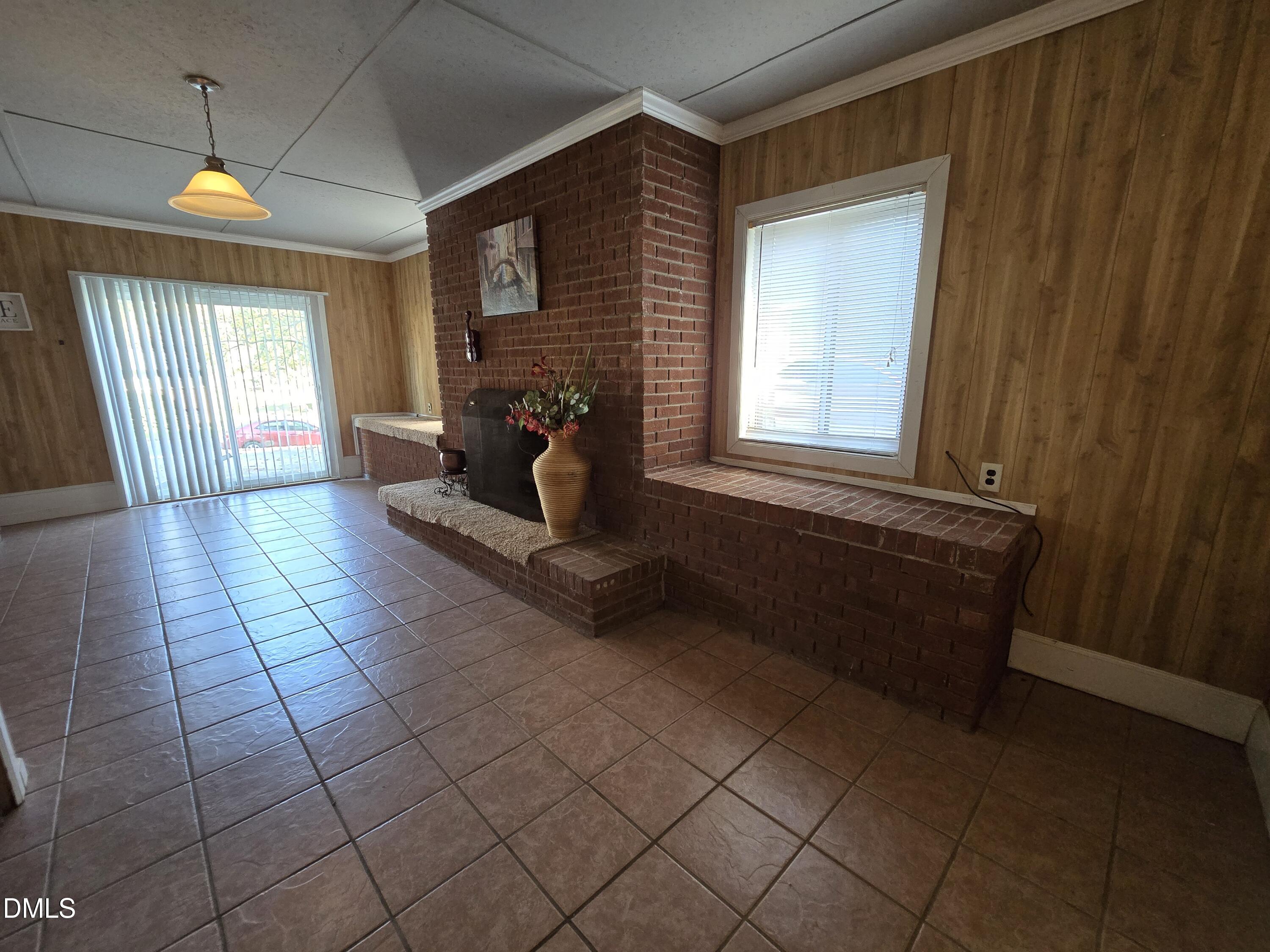 1808 Tee Dee Street Raleigh, NC 27610 - Photo 6 of 10 a living room with couches and a fireplace