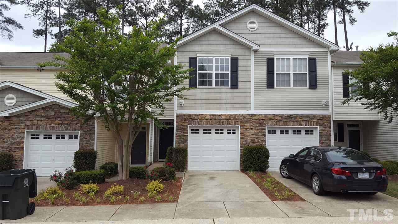 8249 Martello Lane Raleigh, NC 27613 - Photo 2 of 18 a front view of a house with parking space