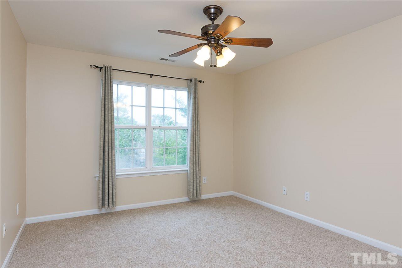 8249 Martello Lane Raleigh, NC 27613 - Photo 12 of 18 an empty room with a window