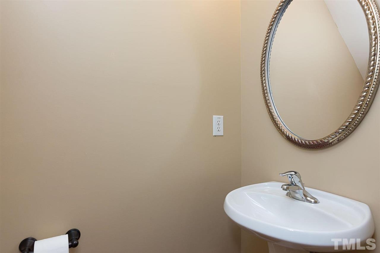 8249 Martello Lane Raleigh, NC 27613 - Photo 9 of 18 a bathroom with a sink and a mirror