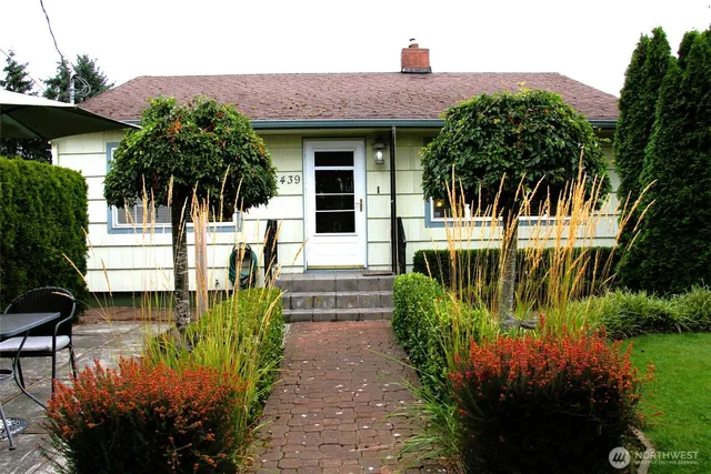 a front view of a house with garden