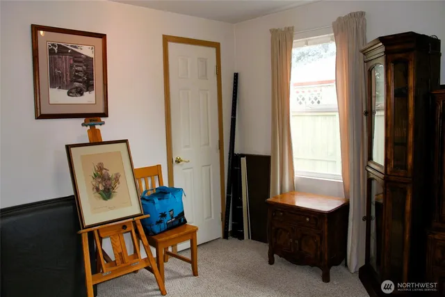 a view of room with window and furniture