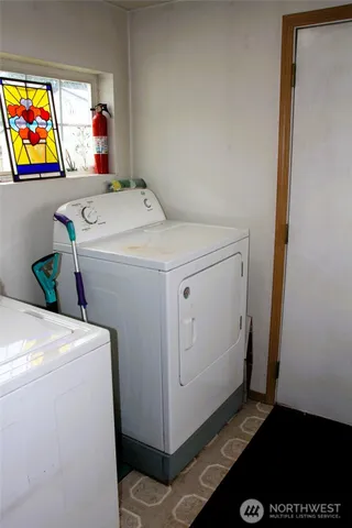 a utility room with dryer and washer