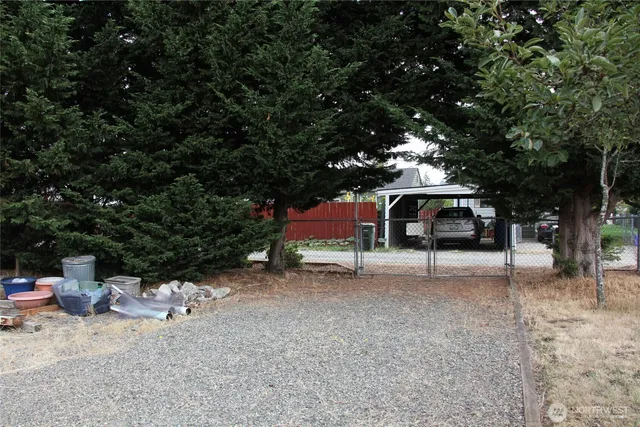 a view of a house with a yard and roof