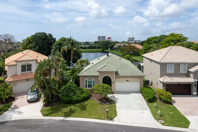 a aerial view of a house with a yard