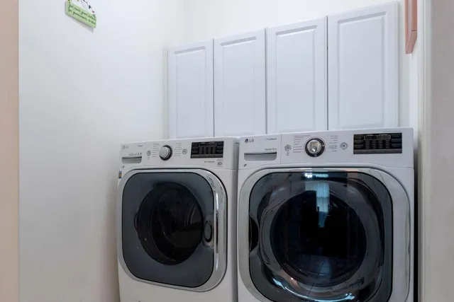 a utility room with dryer and washer