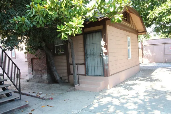 a yellow house with a outdoor space