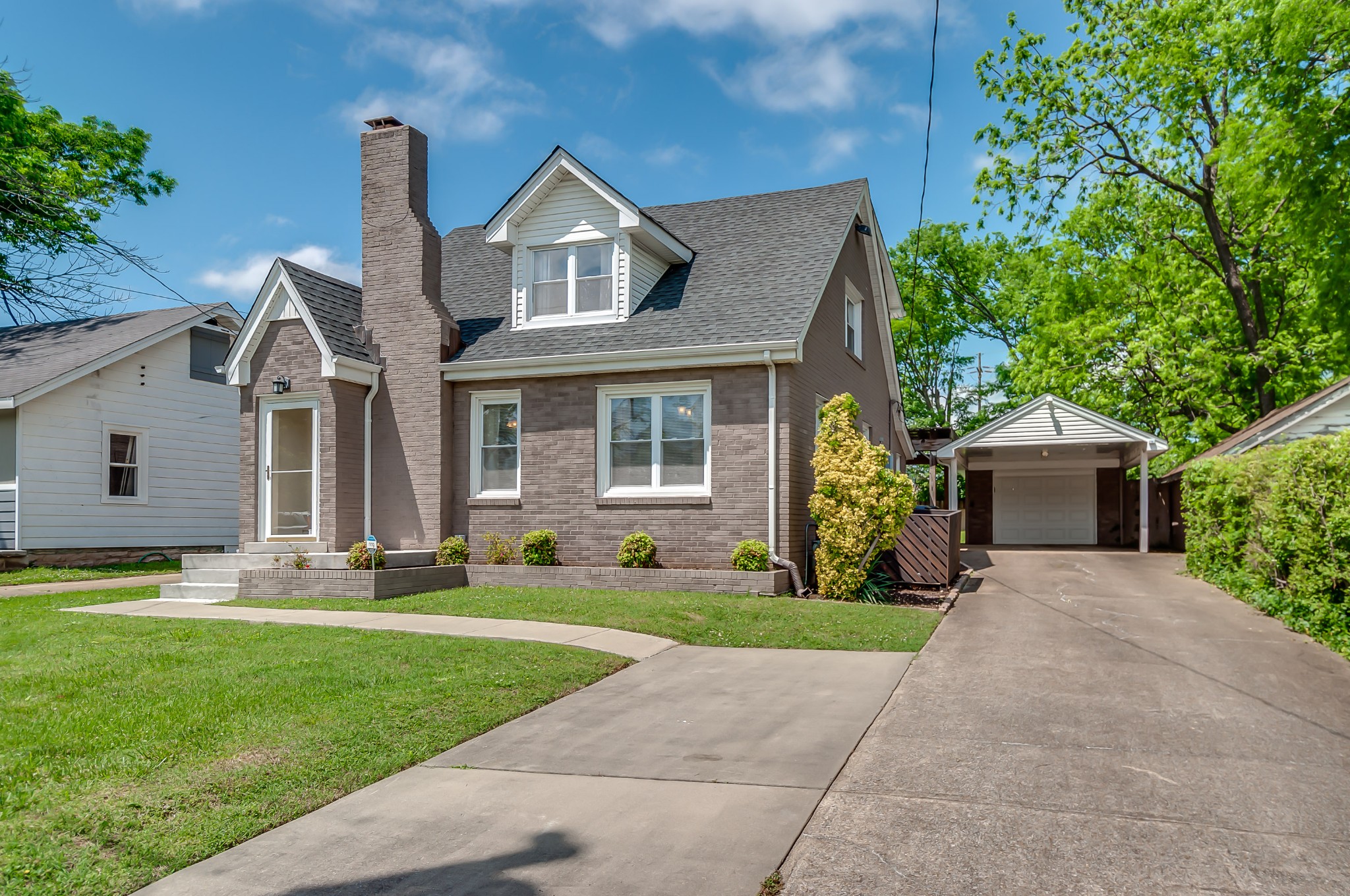 431 Maple Street Madison, TN 37115 - Photo 2 of 42 a front view of a house with a yard and garage