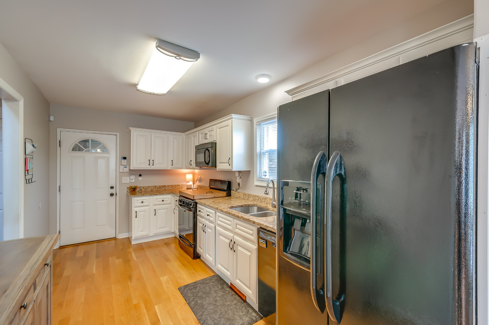 431 Maple Street Madison, TN 37115 - Photo 11 of 42 a kitchen with stainless steel appliances granite countertop a refrigerator and a stove top oven