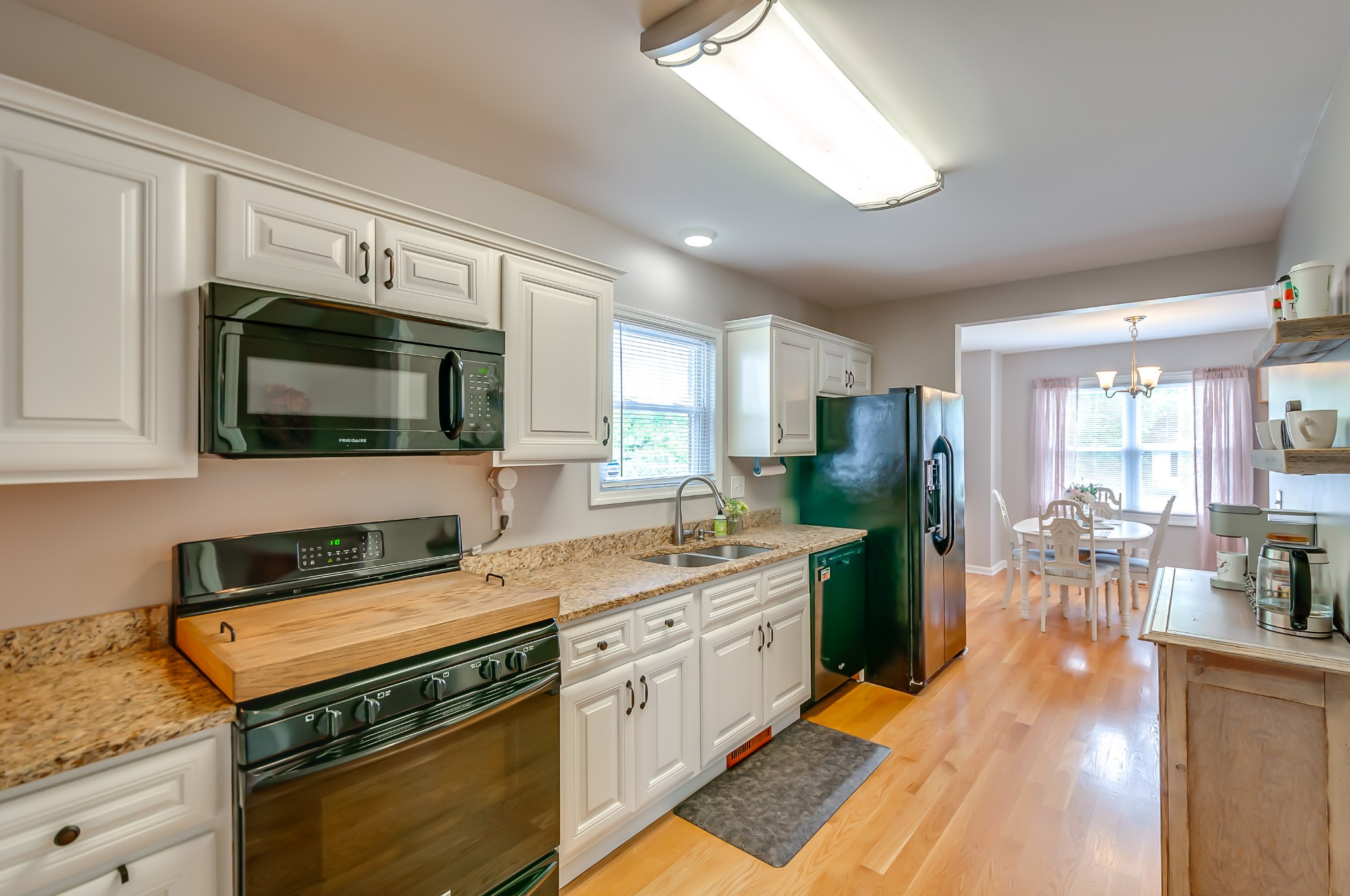 431 Maple Street Madison, TN 37115 - Photo 12 of 42 a kitchen with a stove a sink and a microwave
