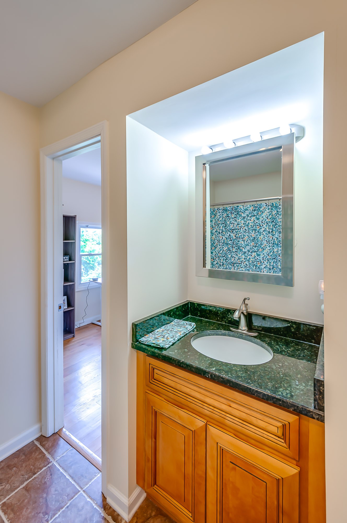 431 Maple Street Madison, TN 37115 - Photo 26 of 42 a bathroom with a granite countertop sink and a mirror