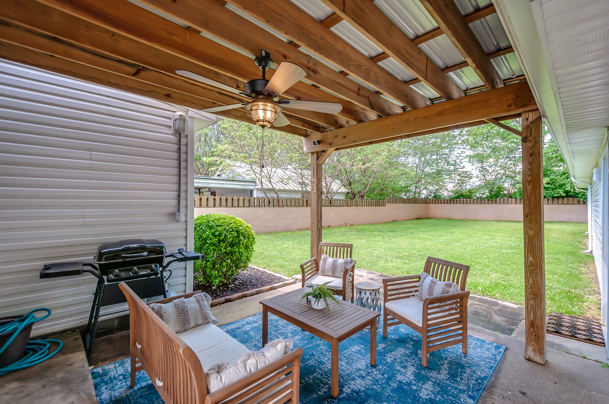 431 Maple Street Madison, TN 37115 - Photo 39 of 42 a view of a patio with chairs and a table