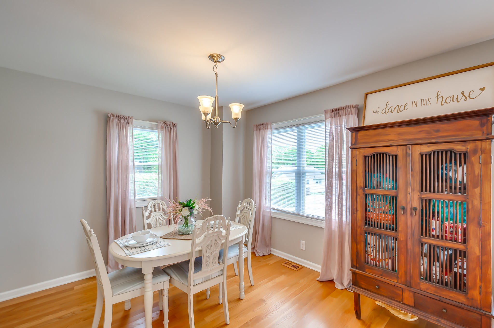 431 Maple Street Madison, TN 37115 - Photo 9 of 42 a view of a dining room with furniture window and wooden floor