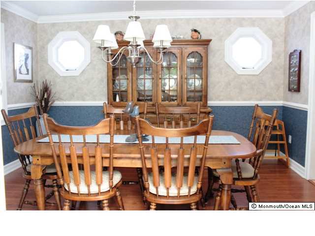 583 Robin Hood Road Brick, NJ 08724 - Photo 11 of 24 a view of a dining room with furniture and chandelier