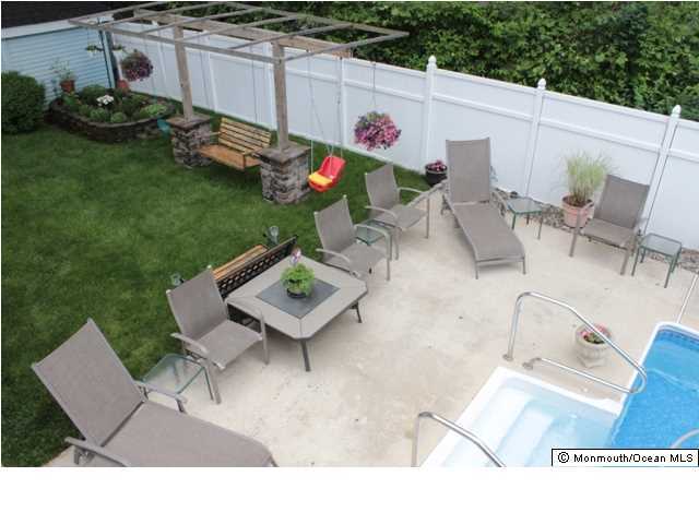 583 Robin Hood Road Brick, NJ 08724 - Photo 21 of 24 a view of a chairs and table in patio