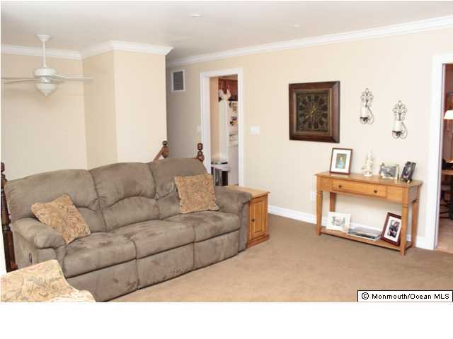 583 Robin Hood Road Brick, NJ 08724 - Photo 3 of 24 a living room with furniture and a table