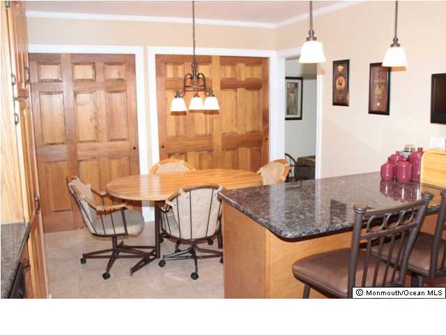 583 Robin Hood Road Brick, NJ 08724 - Photo 6 of 24 a outdoor dining space with furniture