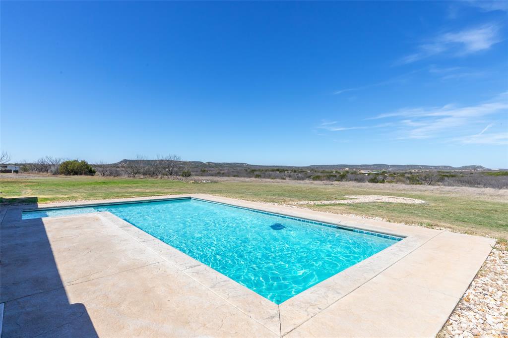 296 Mesquite Ridge Lane Lawn, TX 79530 - Photo 34 of 35 a view of swimming pool and lake view