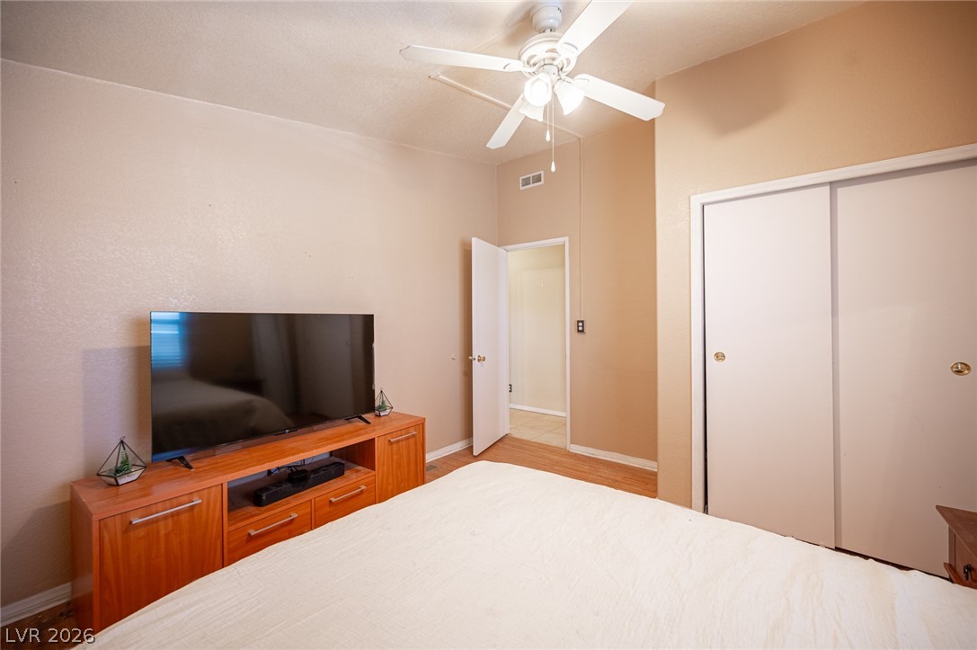 3200 Maple Road Pahrump, NV 89048 - Photo 29 of 53 Relax in comfort with a ceiling fan overhead and easy access to a full closet and adjoining bath.