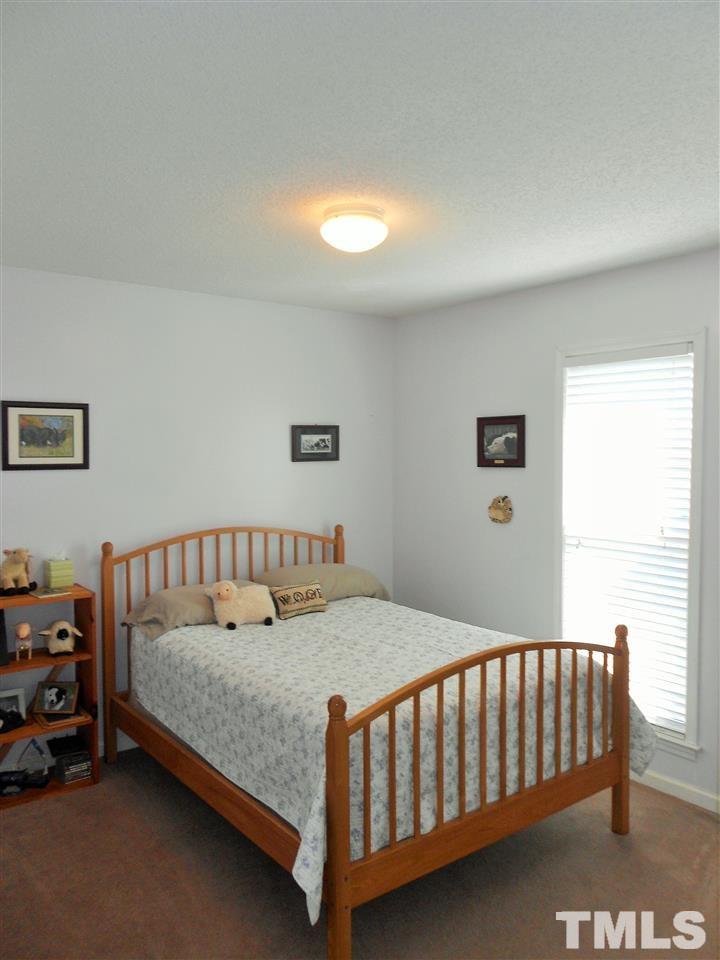 4535 Sugar Maple Road Oxford, NC 27565 - Photo 13 of 25 a bedroom with a bed and a window