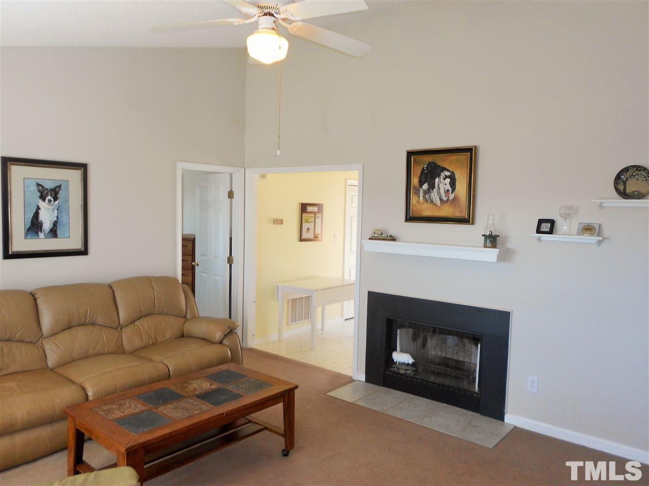 4535 Sugar Maple Road Oxford, NC 27565 - Photo 3 of 25 a living room with furniture and a fireplace