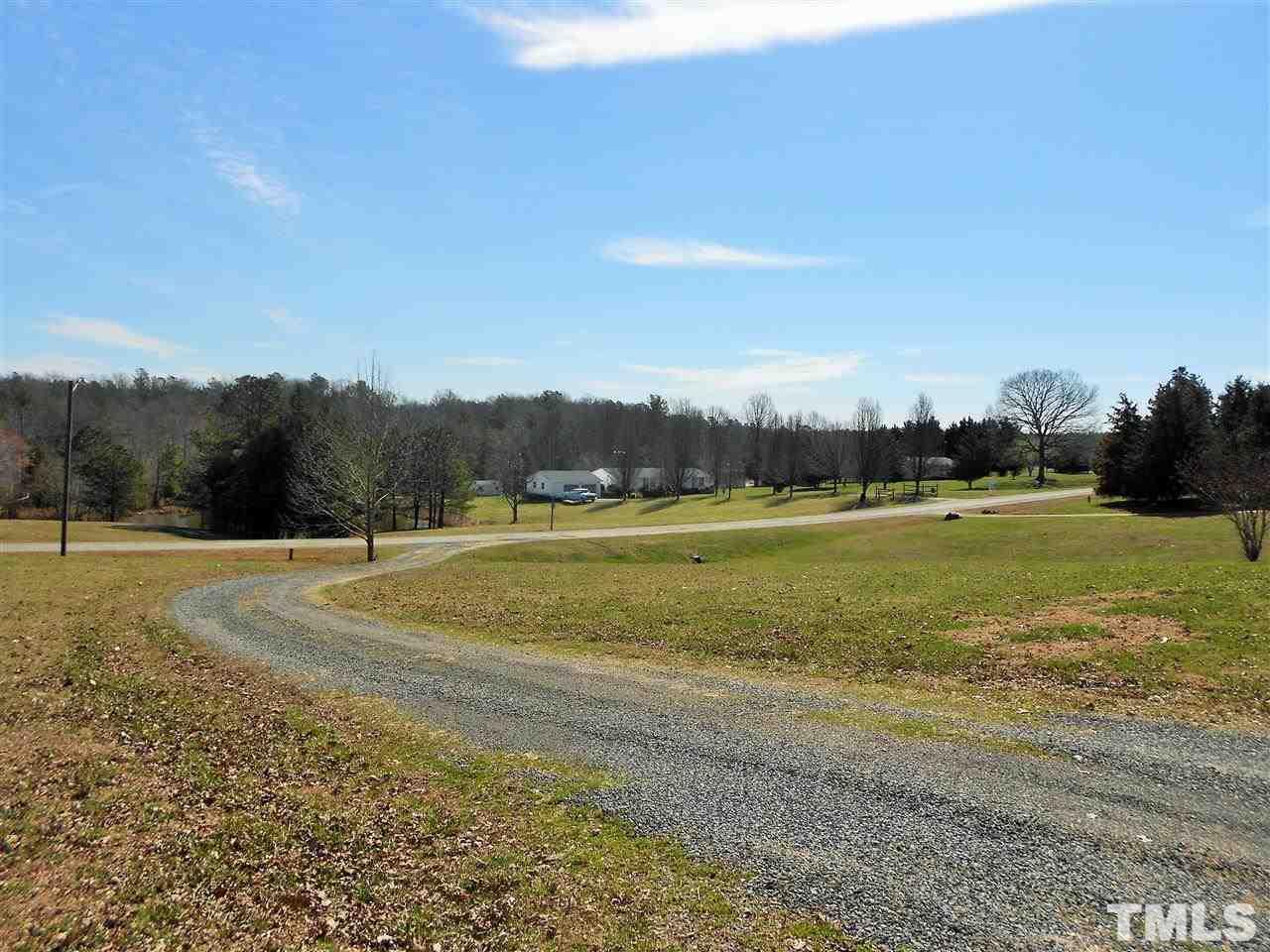 4535 Sugar Maple Road Oxford, NC 27565 - Photo 21 of 25 a view of a golf course with a lake