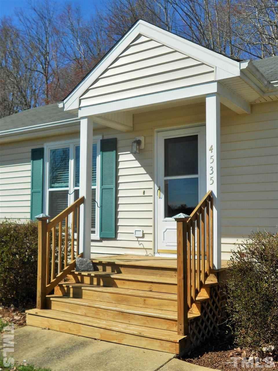 4535 Sugar Maple Road Oxford, NC 27565 - Photo 24 of 25 a front view of a house with a yard