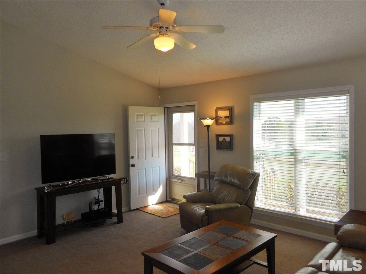 4535 Sugar Maple Road Oxford, NC 27565 - Photo 4 of 25 a living room with furniture and a flat screen tv