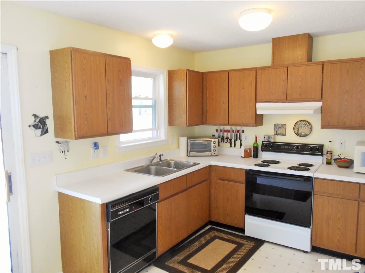 4535 Sugar Maple Road Oxford, NC 27565 - Photo 6 of 25 a kitchen with a sink stove and cabinets