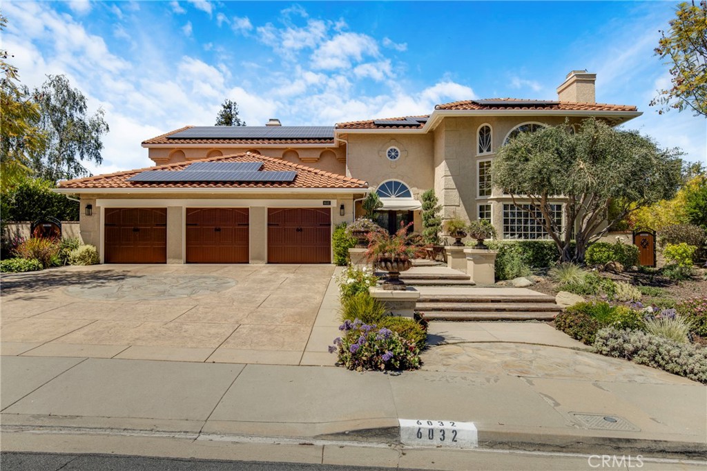 6032 Grey Rock Road Agoura Hills, CA 91301 - Photo 1 of 54 a front view of a building with garden