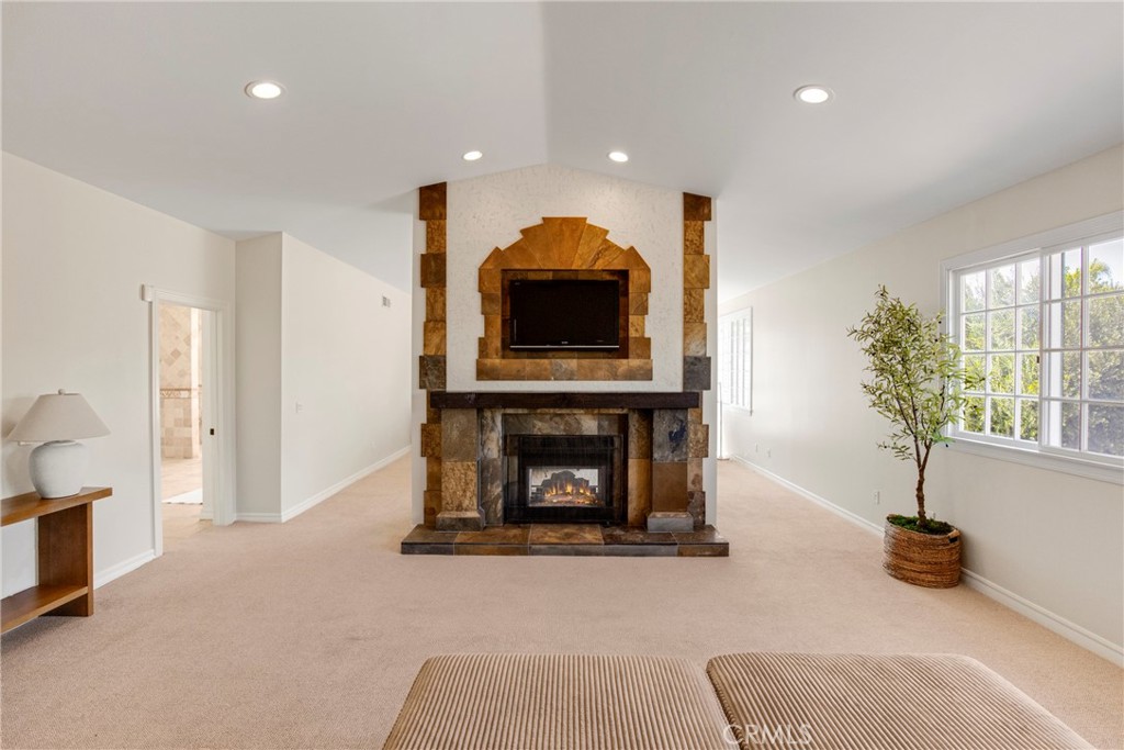 6032 Grey Rock Road Agoura Hills, CA 91301 - Photo 21 of 54 a living room with furniture and a fireplace