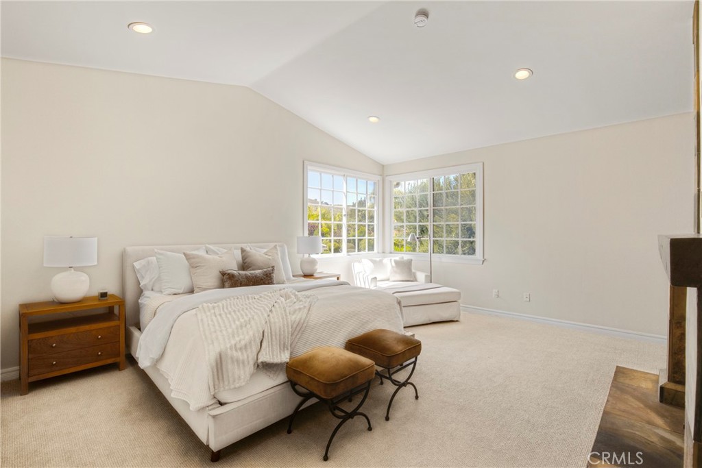 6032 Grey Rock Road Agoura Hills, CA 91301 - Photo 22 of 54 a bedroom with a bed and a couch