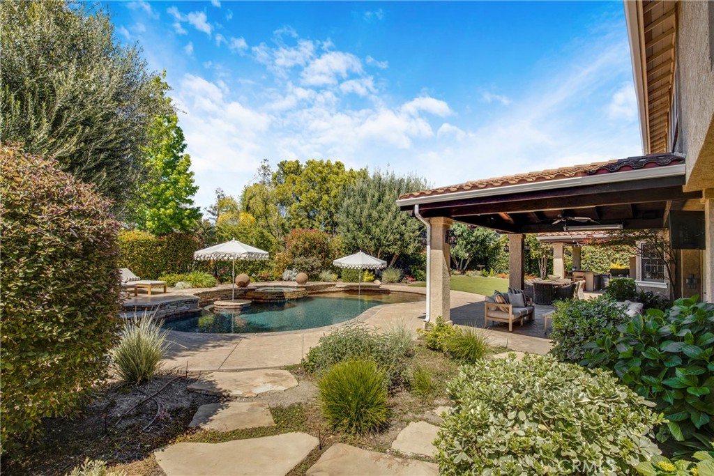 6032 Grey Rock Road Agoura Hills, CA 91301 - Photo 36 of 54 a view of swimming pool with outdoor seating and plants