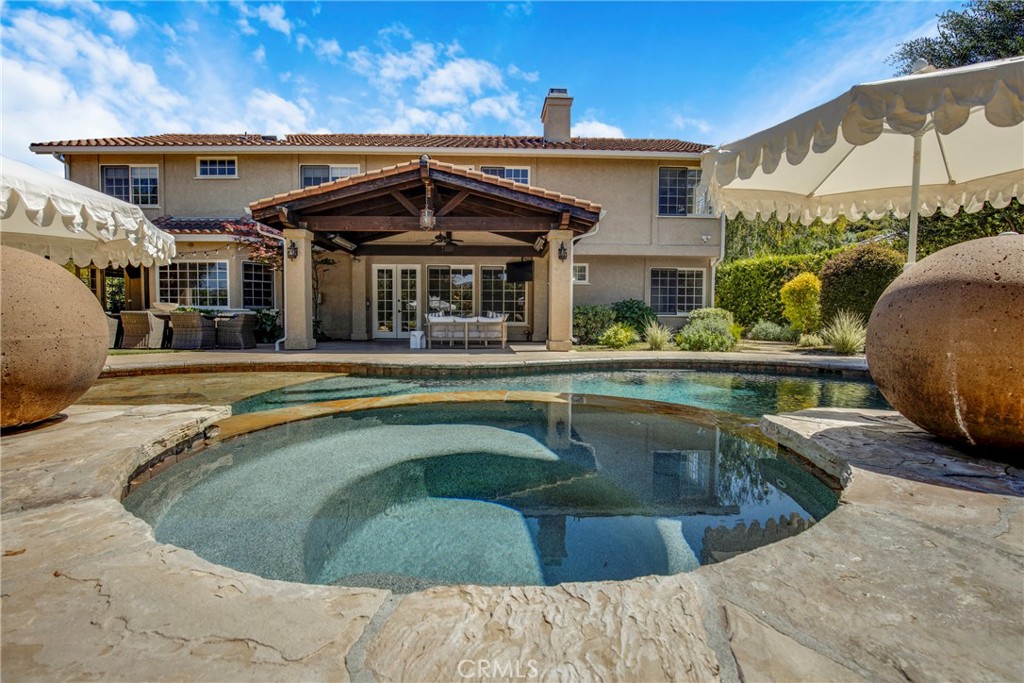 6032 Grey Rock Road Agoura Hills, CA 91301 - Photo 39 of 54 a view of a house with swimming pool