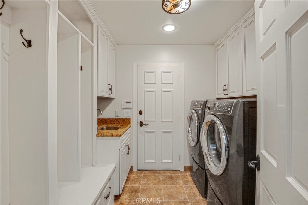 6032 Grey Rock Road Agoura Hills, CA 91301 - Photo 42 of 54 a utility room with dryer and washer