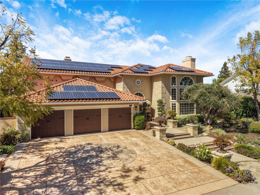 6032 Grey Rock Road Agoura Hills, CA 91301 - Photo 44 of 54 front view of a house with a garden
