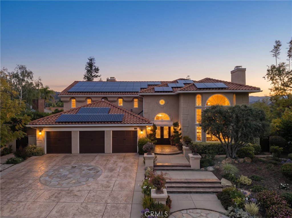 6032 Grey Rock Road Agoura Hills, CA 91301 - Photo 45 of 54 a front view of a house with garden