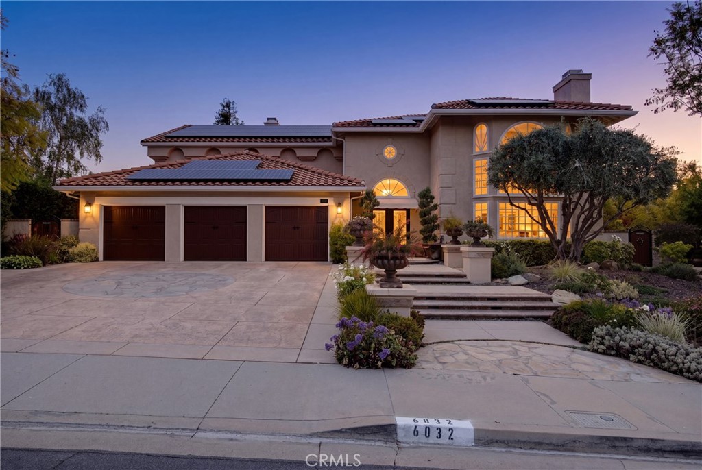 6032 Grey Rock Road Agoura Hills, CA 91301 - Photo 46 of 54 a front view of a house with a garden