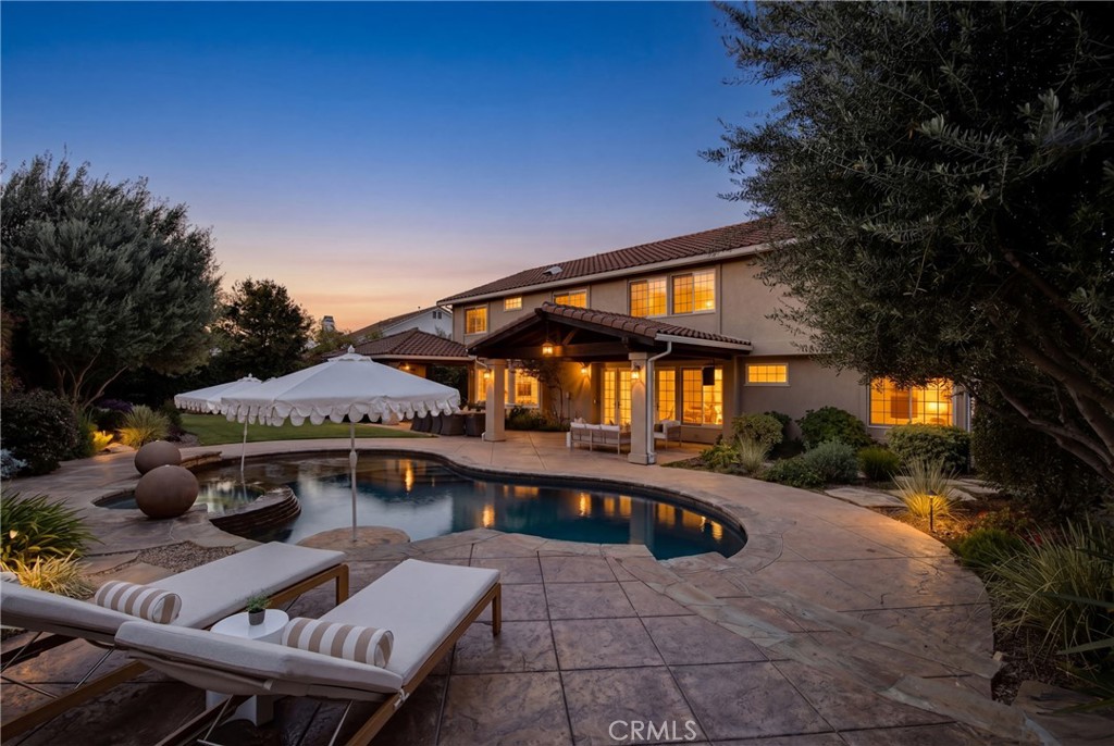 6032 Grey Rock Road Agoura Hills, CA 91301 - Photo 47 of 54 a view of a house with swimming pool and sitting area