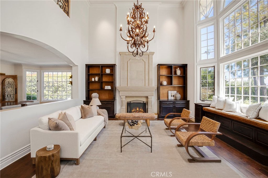 6032 Grey Rock Road Agoura Hills, CA 91301 - Photo 6 of 54 a living room with furniture fireplace and window