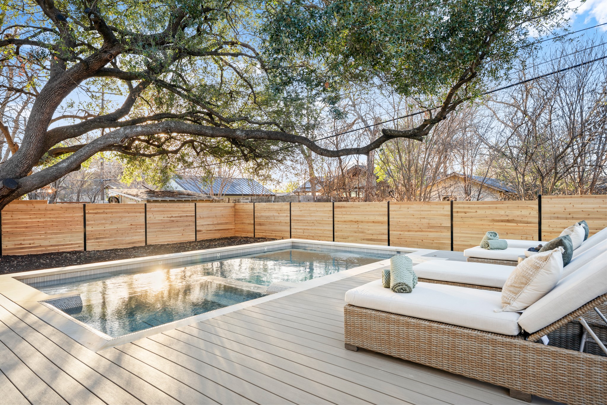7706 Rutgers Avenue Austin, TX 78757 - Photo 17 of 35 View of pool featuring a fenced backyard and a deck