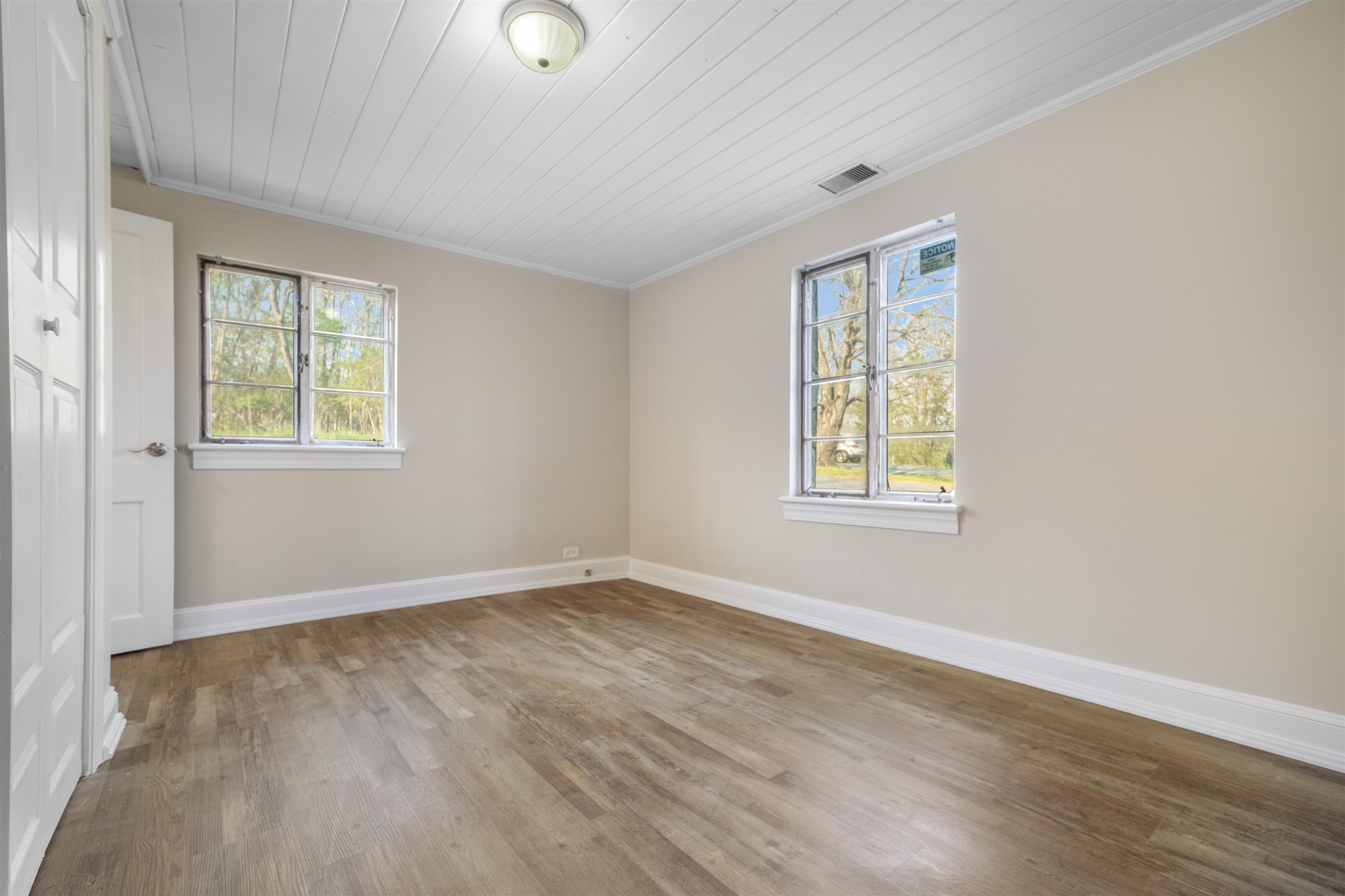 1641 Smithland Road Harrisonburg, VA 22802 - Photo 24 of 44 an empty room with wooden floor and windows