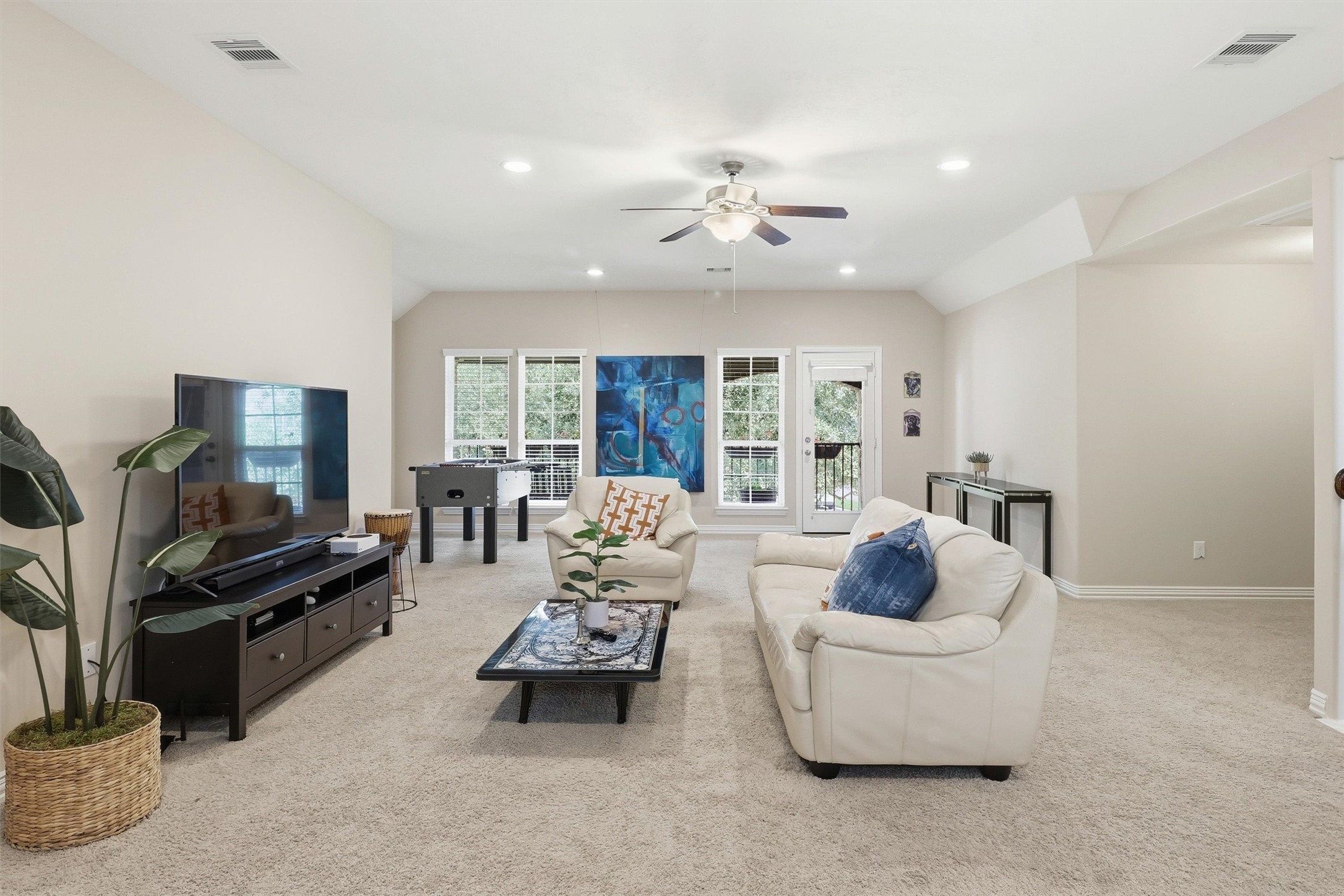 3219 Cotton Ranch Drive Katy, TX 77494 - Photo 26 of 45 Designed with flexibility & comfort in mind, the expansive upstairs game room offers an impressive amount of living space with plush carpeting, soaring ceilings, recessed lighting, & a ceiling fan for year-round comfort.