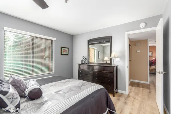 a bedroom with a large bed and a dresser
