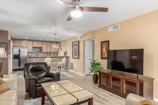 a living room with furniture and a flat screen tv